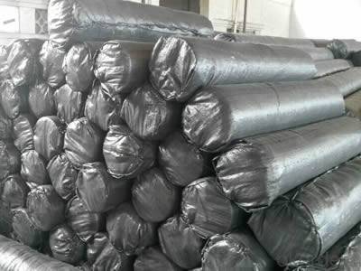 Rolls of silt fence fabrics are packed in black woven bags.