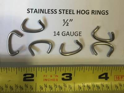 There are some 14 gauge stainless steel hog rings and a open measuring tape.